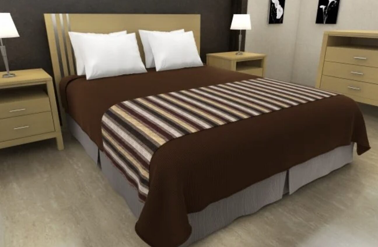 hotel bed with fabric strip